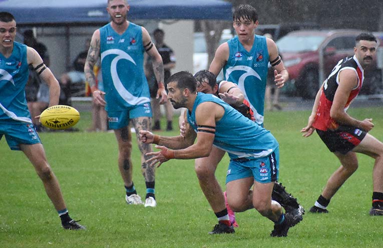 Saints win in the wet to open their AFL season