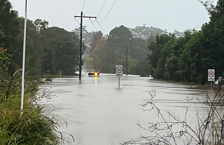 Heavy rain submerges new flood warning signs in Nana Glen