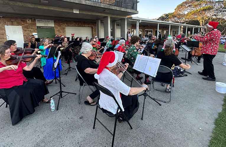 Christmas Carol on the lawn at Sawtell Surf Club