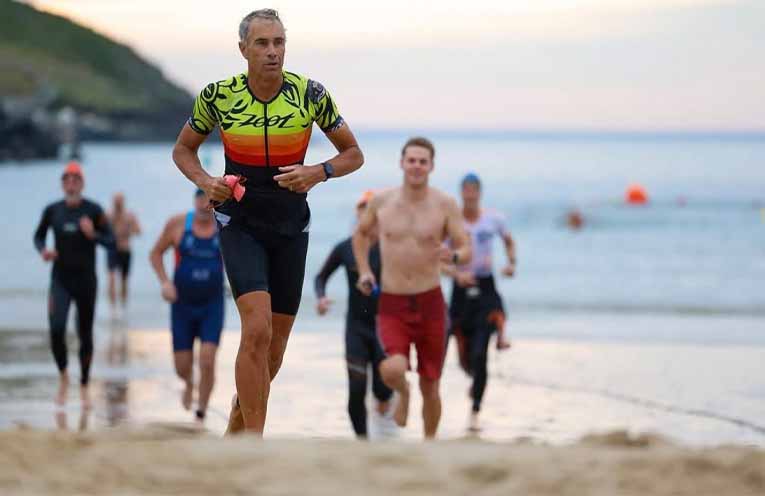 Coffs Harbour Triathlon Club member Michael Singleton heads out of the ocean. Photo: Danni MacCue Photography.
