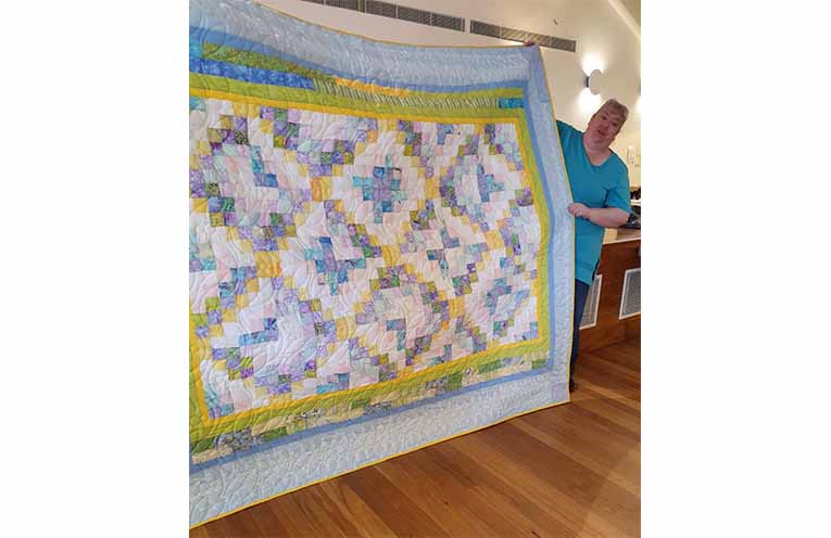 Winner of the raffle quilt, Belinda Saxby.