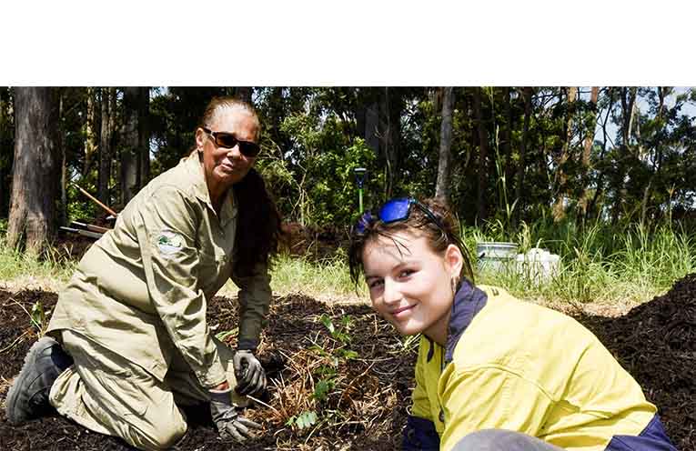 Della Byrnes (front) on the land.