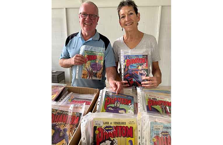 Coffs Rotary member Michael Brown and his wife Liesel and the Phantom comics collection.