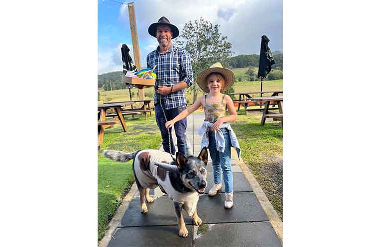Best dressed dog: Smudge the Blue Cow with his family. Photo: Kate Pye.