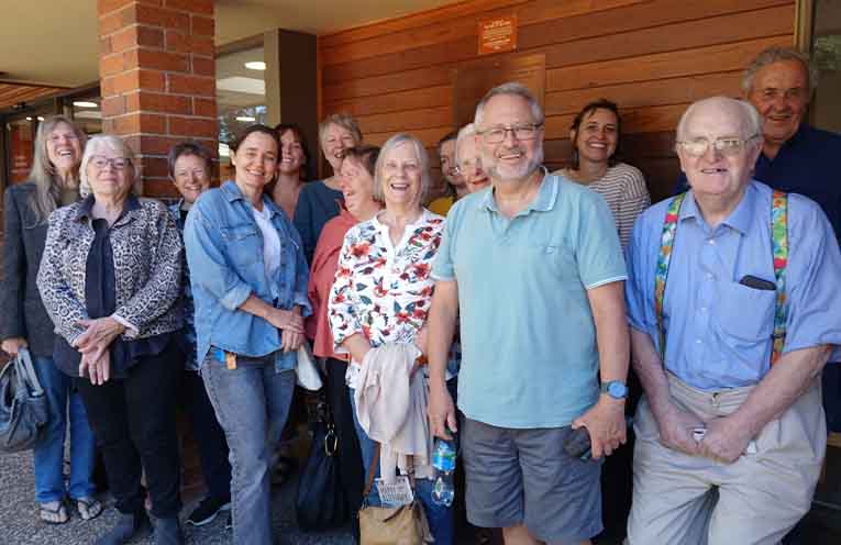 Board members and supporters celebrate the council's decision.