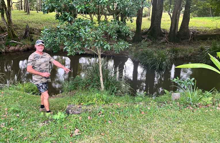 Dave Gentle at the natural frog breeding site beside a tributary of the Orara River.