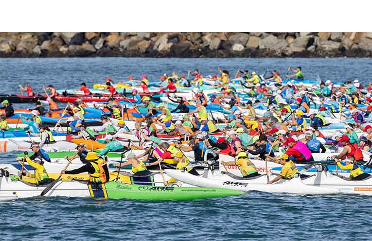 A sea of colour as outrigger crews race for position. Photo: Rob Cleary.
