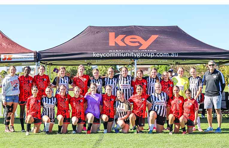 The Coffs City United Pridettes and Bellingen in front of Bailey’s Box.