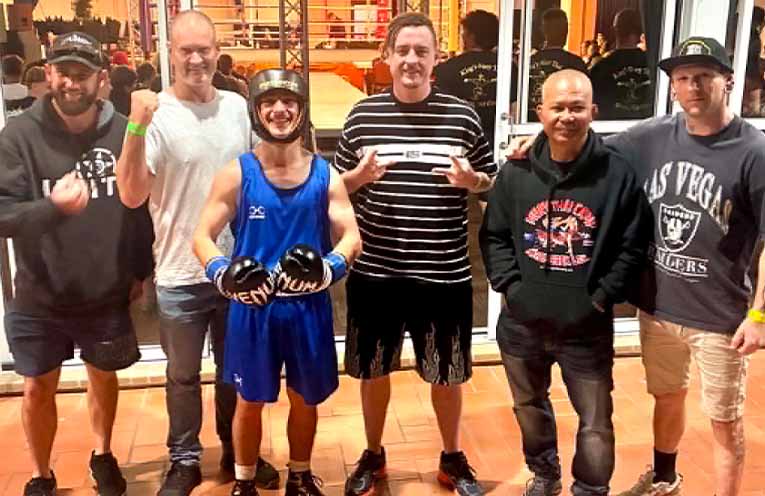 Boxing prodigy Kaleb Pallas with his training team. Photo: Supplied.