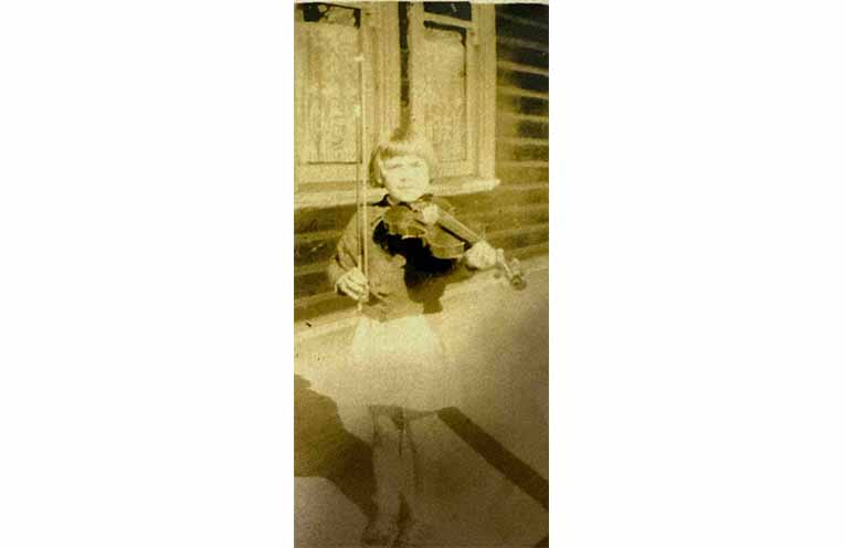 Ruth commencing her violin lessons in 1941.