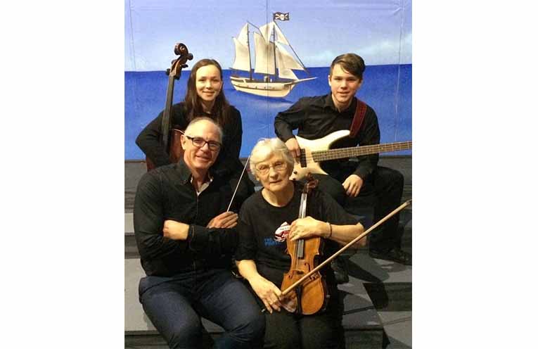 Ruth Egan with son Tim and grandchildren Stephanie and Jacob, who are also competent musicians.