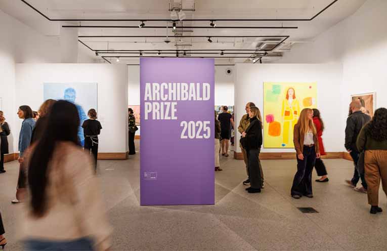 Visitors in the Archibald Prize 2025 exhibition at Yarrila Arts and Museum featuring (left-right) Fiona Lowry Ken Done, Angela Brennan Bridget in my painting.