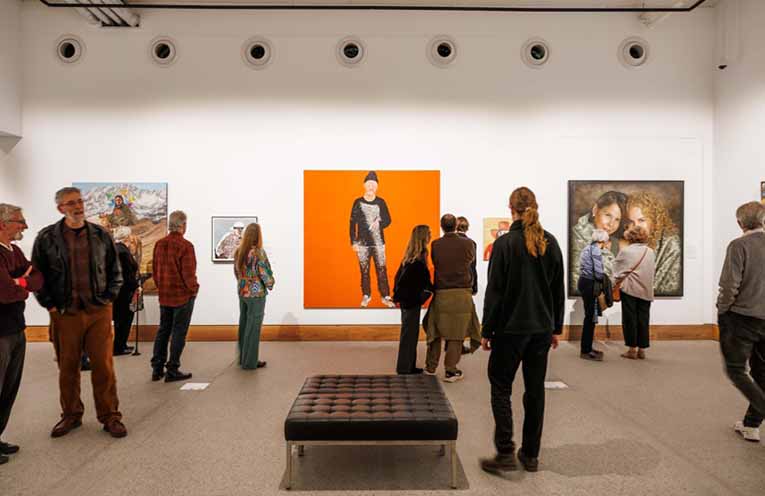 Visitors in the Archibald Prize 2025 exhibition at Yarrila Arts and Museum featuring (left-right) Clare Thackway With the shadow, Whitney Duan Banquet (Rainbow Chan), Julie Fragar, Flagship Mother Multiverse (Justene), Jeremy Eden Felix Cameron.
All artworks © the artists.
Photos © And the trees photography.