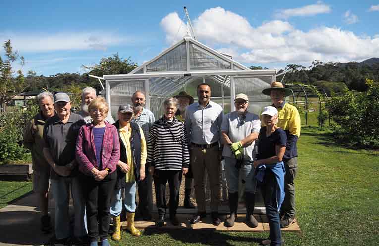 Mr Singh with South Coffs Community Garden volunteers at the opening of the new glasshouse. Photo: Supplied.