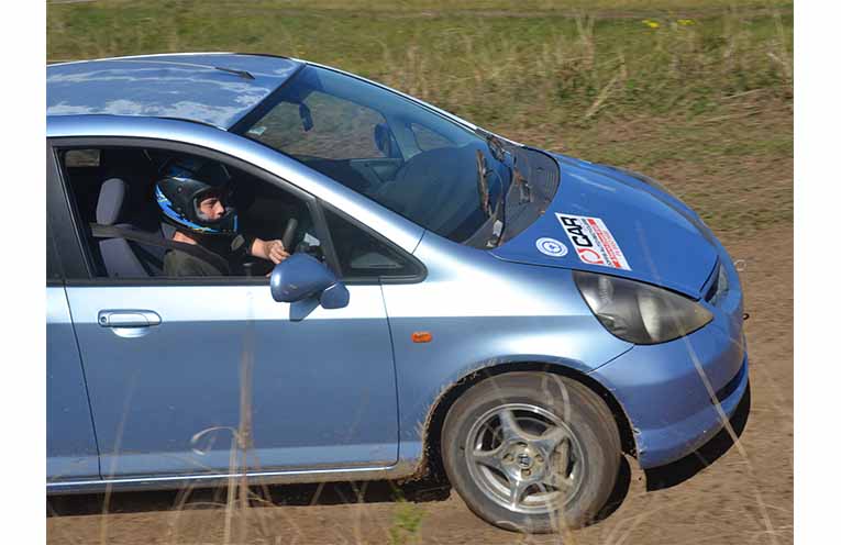 Jett Drough, behind the wheel of the Club Car in his first-ever event. Coaching from the passenger seat is experienced rally driver Tony Lynch.