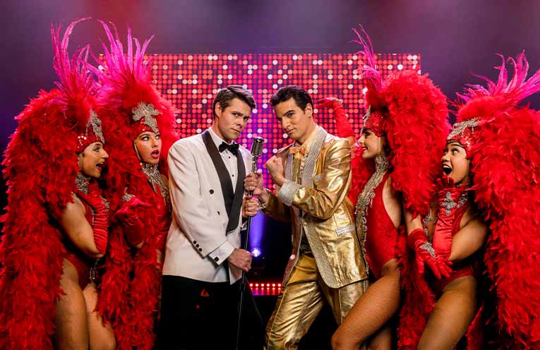Jonathan Guthrie-Jones and Anthony Petrucci with show dancers.