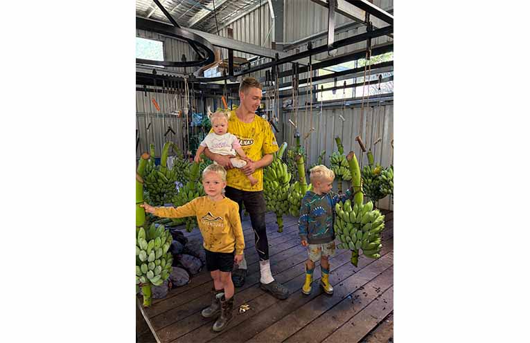 Fourth-generation Coffs Harbour banana farmer Jason Gentle and his three children.