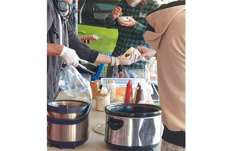 Helping hands distributing food in Coffs Harbour. Photo: Sharon Jane.