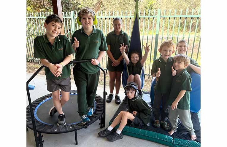 Aspect Macarthur School students with the new play equipment donated by Rotary Club of Sawtell.